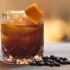 Old fashion cocktail drink with coffee beans