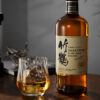A bottle of Japanese Whisky Taketsuru and A glass of whisky