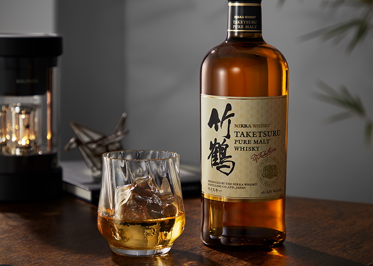 A bottle of Japanese Whisky Taketsuru and A glass of whisky